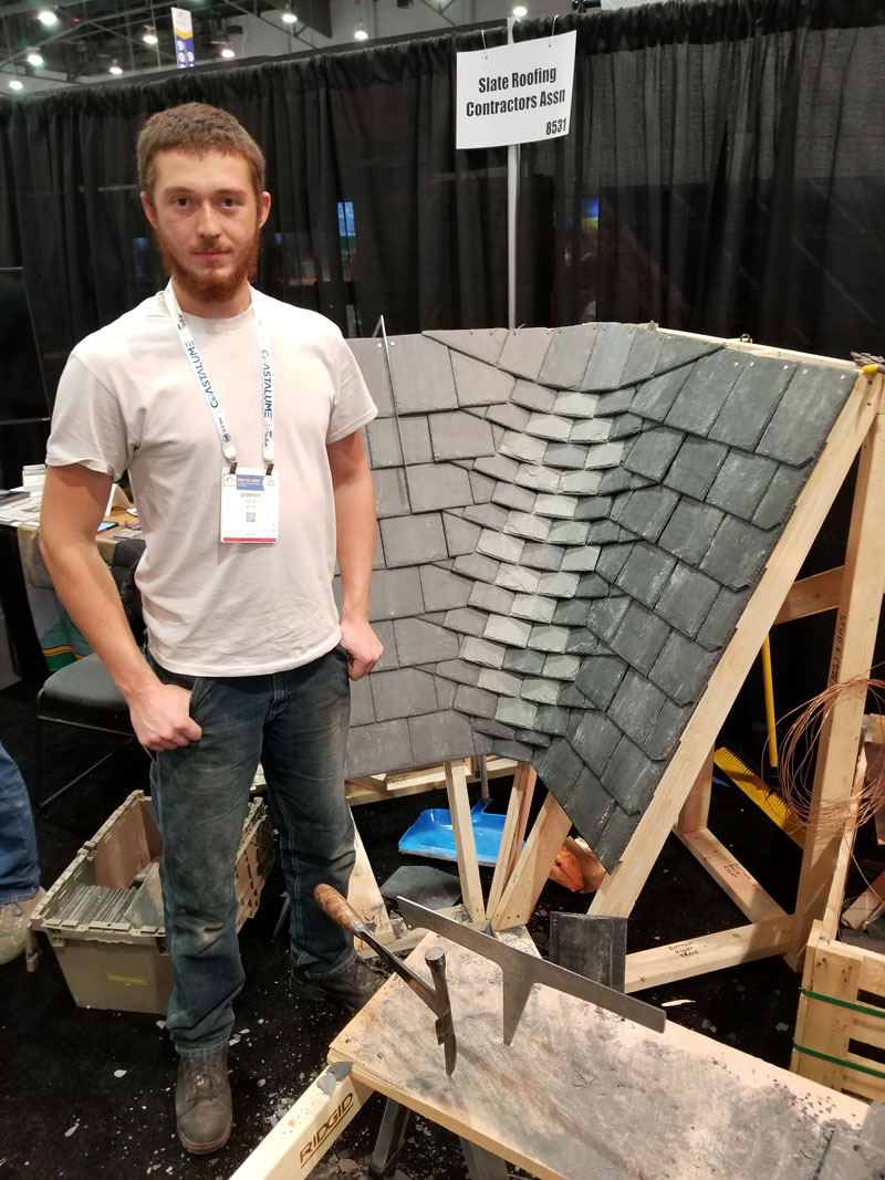 Dominic Nave of Jenkins Slate Masters Inc. demonstrates a rounded woven slate valley at the 2024 International Roofing Expo in Las vegas Nevada, February 6-8. Dominic Nave of Jenkins Slate Masters Inc. demonstrates a rounded woven slate valley at the 2024 International Roofing Expo in Las Vegas Nevada, February 6-8.